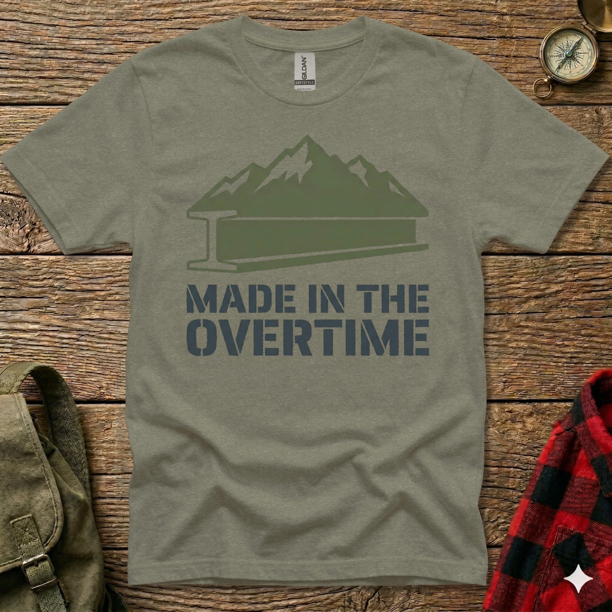 Green t-shirt with mountains and "Made in the Overtime" text.