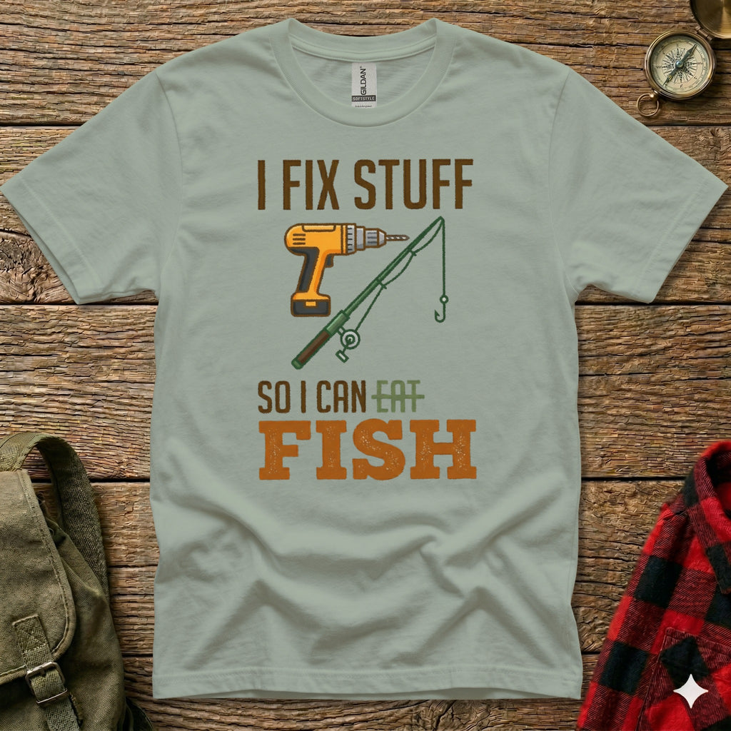Green t-shirt with "I FIX STUFF SO I CAN EAT FISH" text and drill and fishing rod graphic.