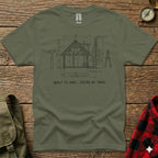 Blueprint of a cabin on a t-shirt with "Built to Spec, Tested by Trail".