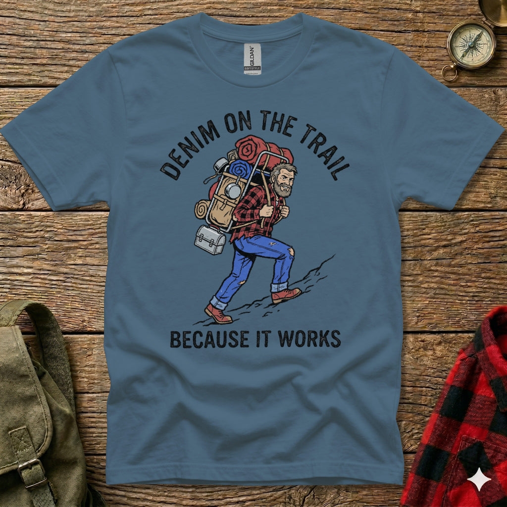 Blue t-shirt with graphic of man hiking with backpack, text "Denim on the Trail Because it Works".