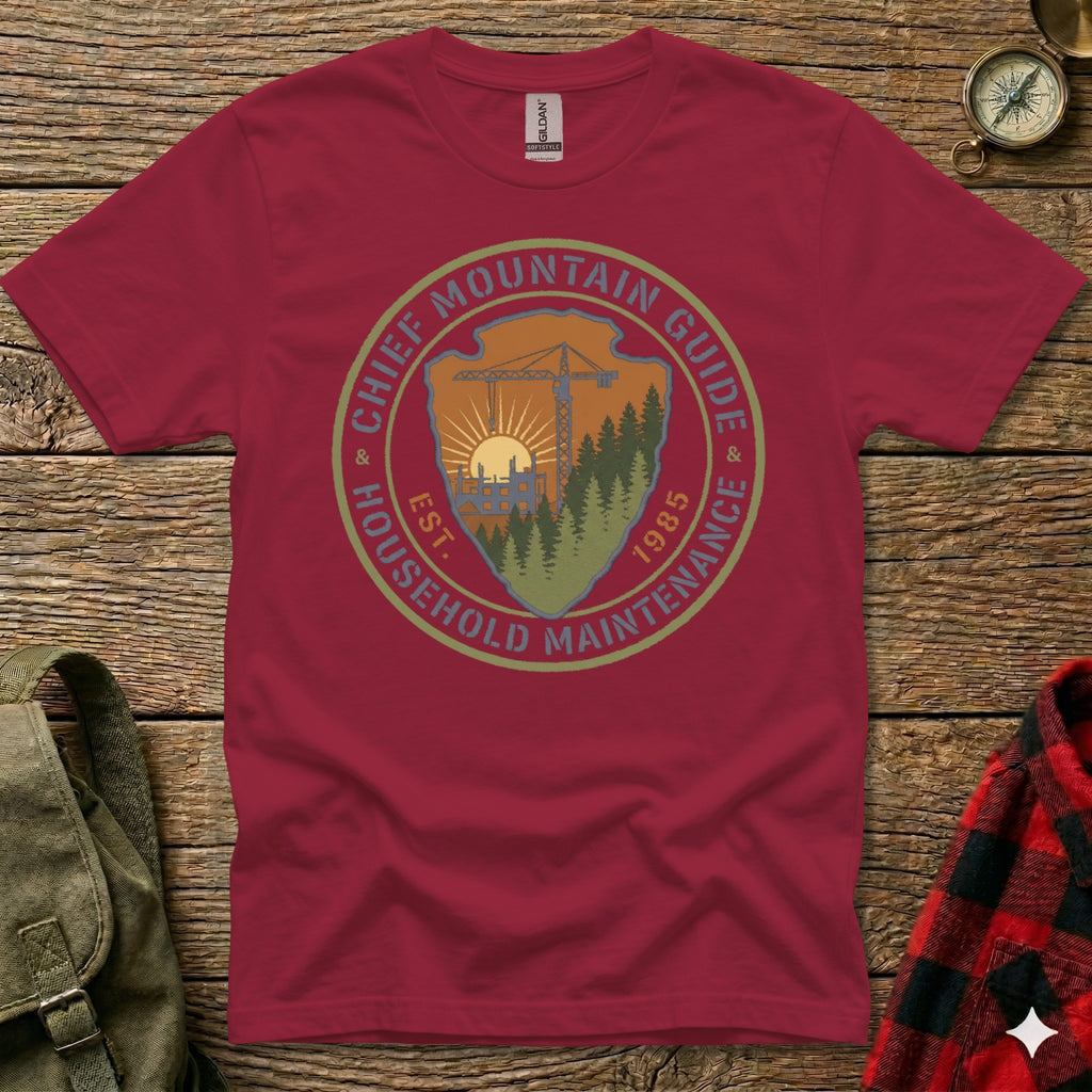 Crimson t-shirt with circular "Chief Mountain Guide Household Maintenance" logo and "Est. 1985" text.