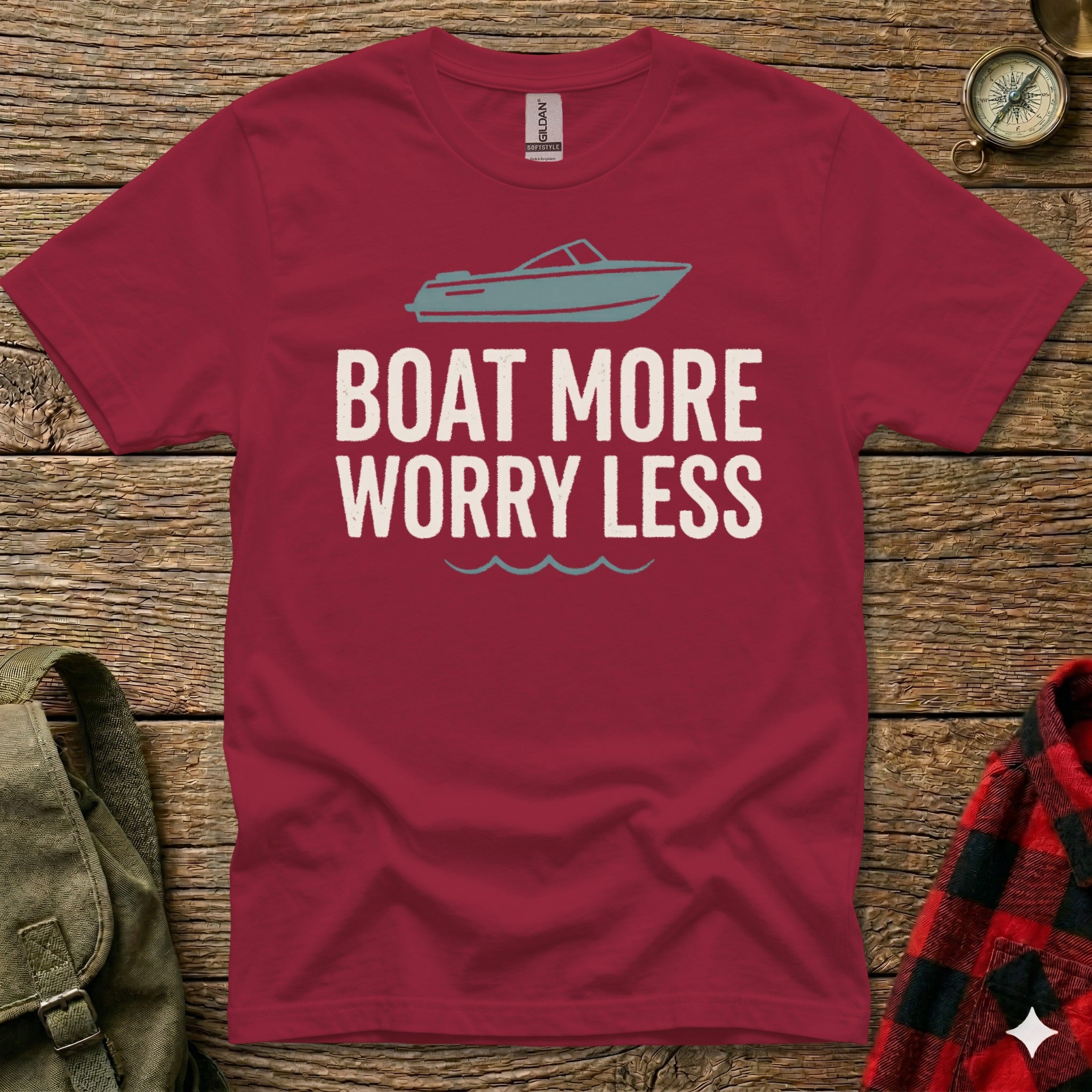 Maroon t-shirt with white text reading "BOAT MORE WORRY LESS" and wavy lines.