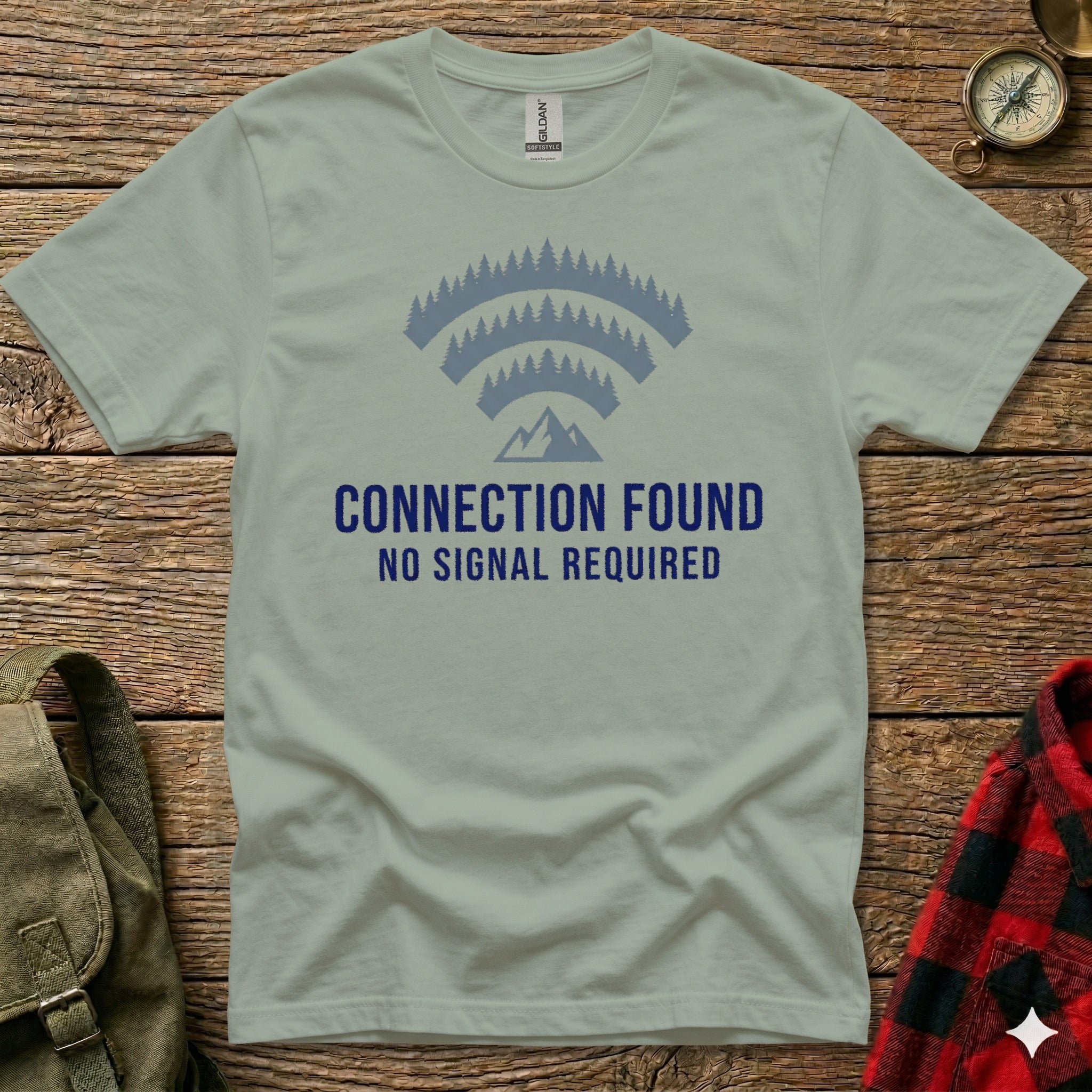 T-shirt with "CONNECTION FOUND NO SIGNAL REQUIRED" and forest mountain Wi-Fi symbol.