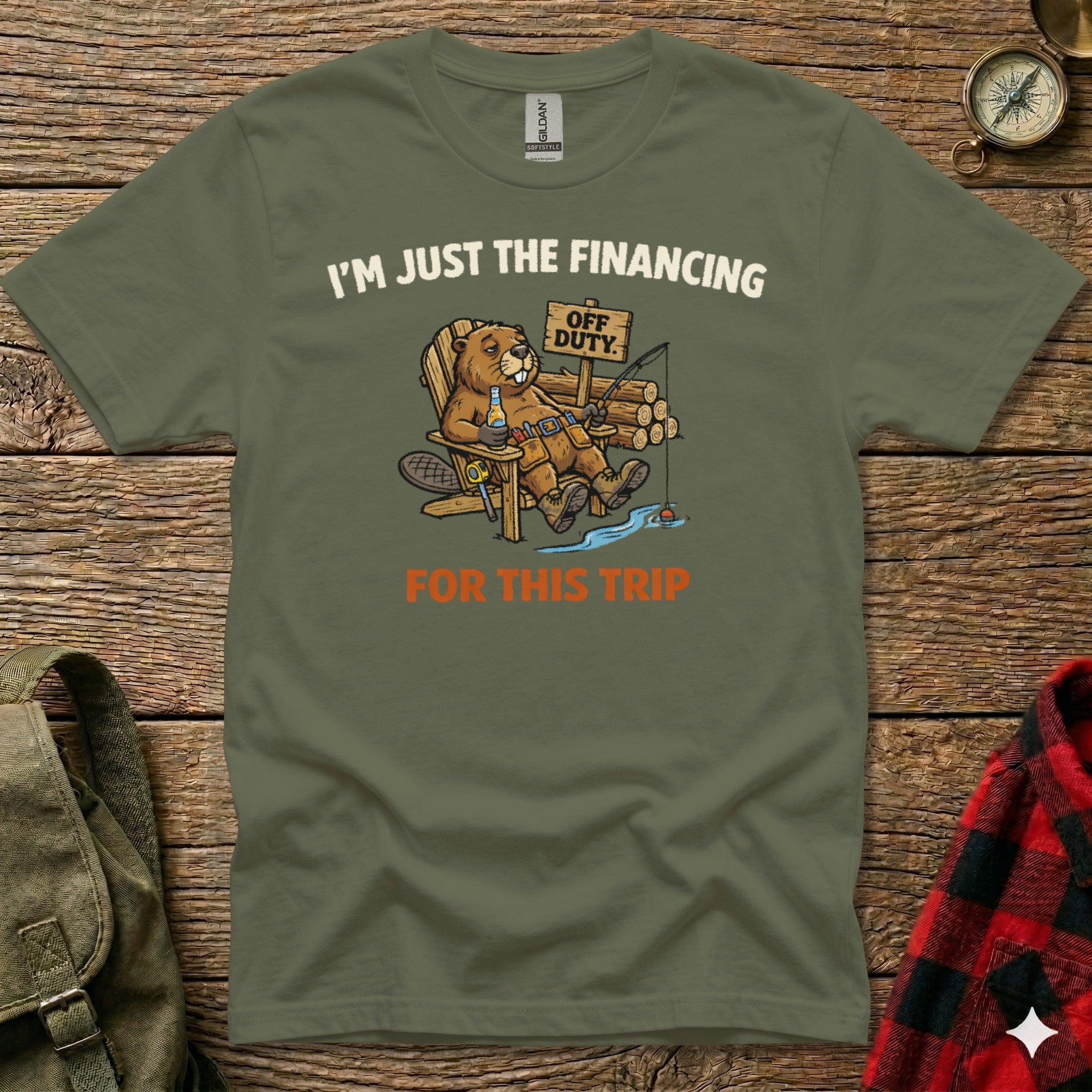 T-shirt with a beaver fishing, text "I'm Just The Financing Off Duty For This Trip".