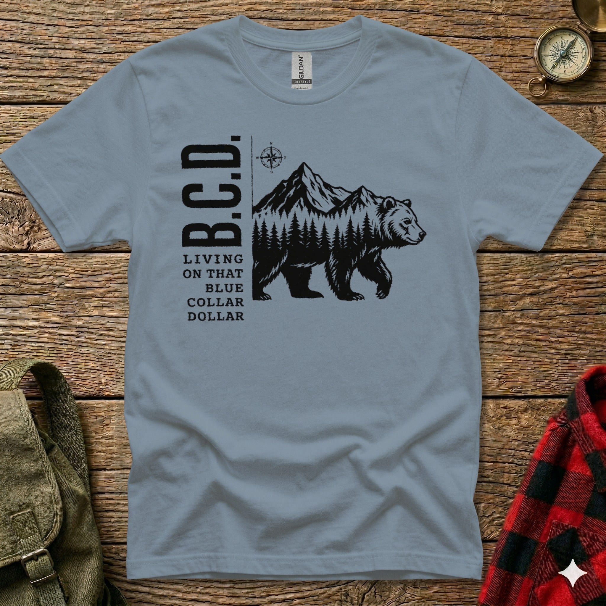 T-shirt with B.C.D. logo and bear in mountains graphic.