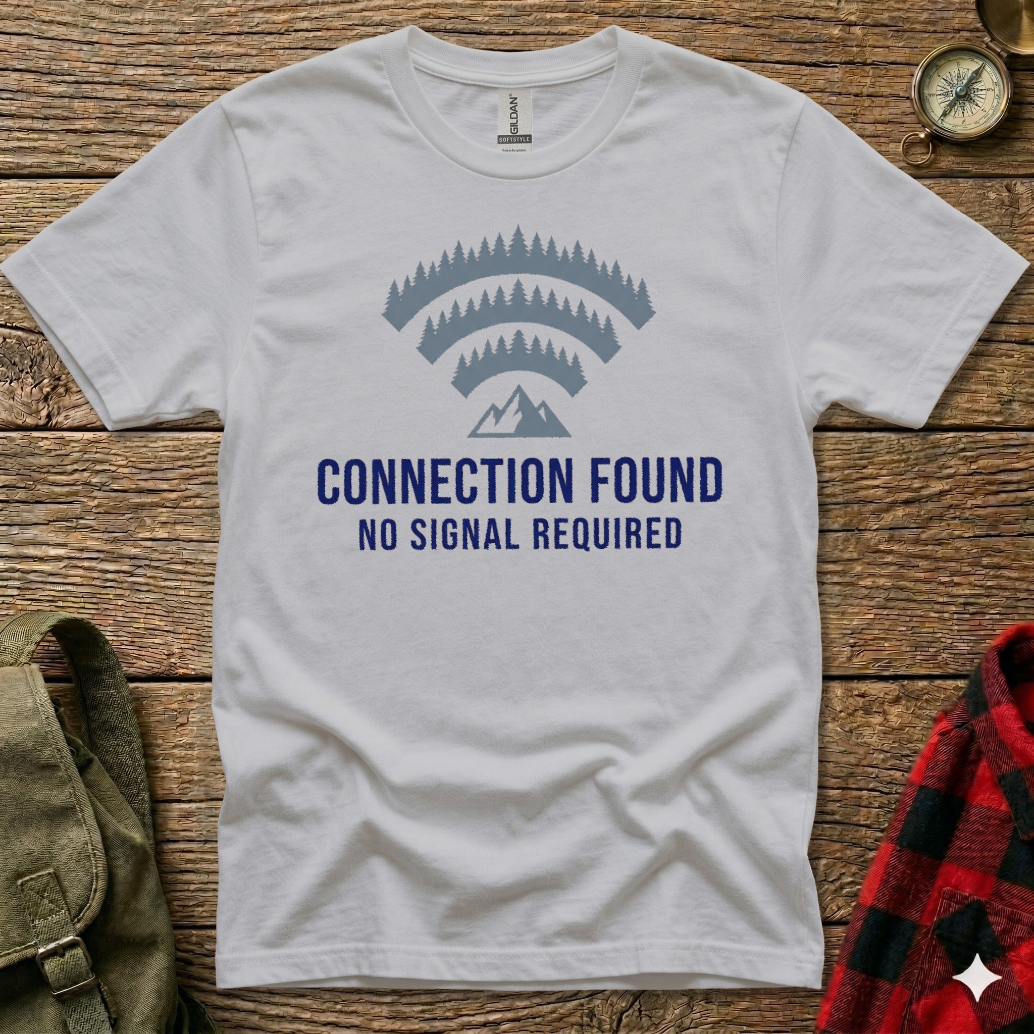 White t-shirt with "CONNECTION FOUND NO SIGNAL REQUIRED" and mountain graphic.