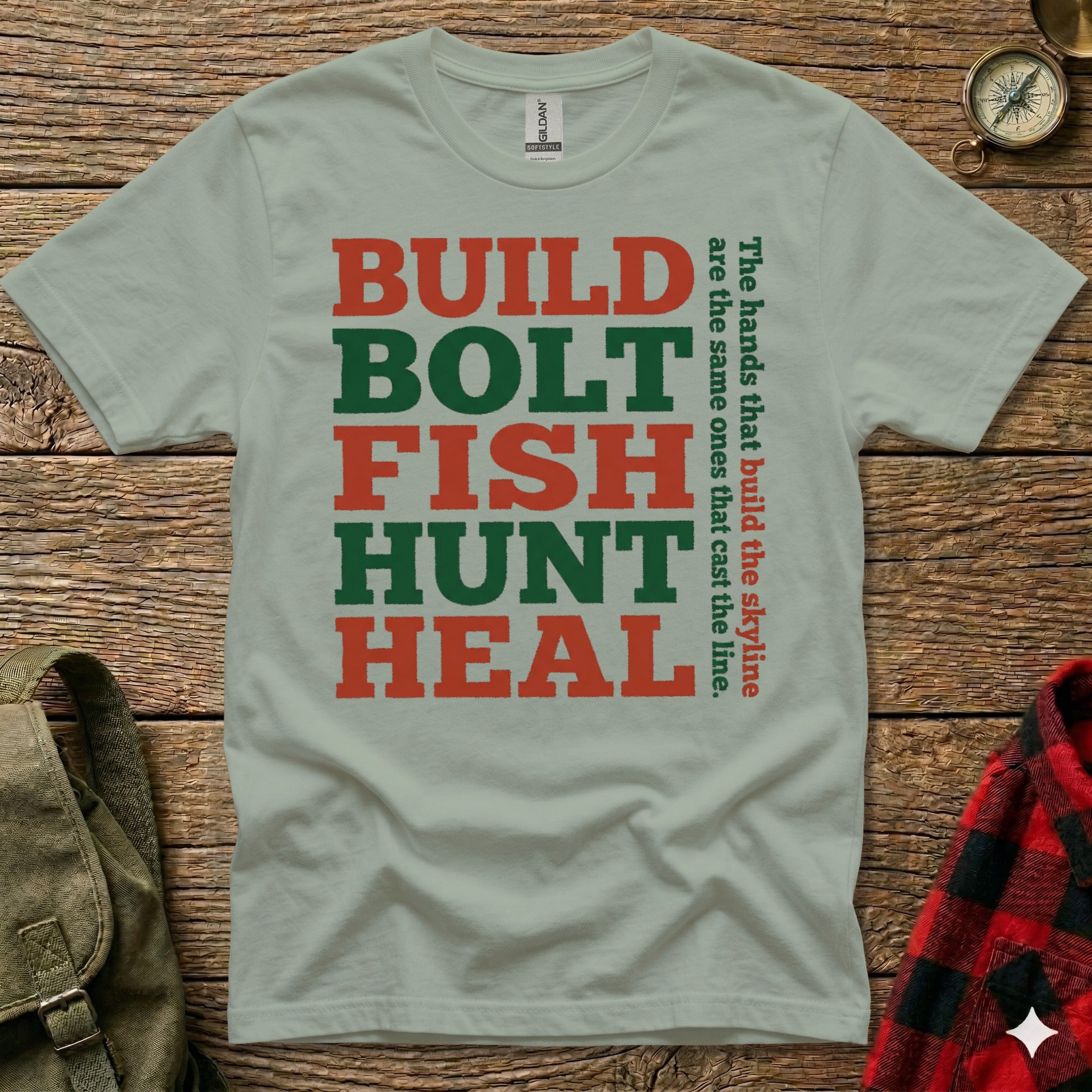 Green and red text on a light green t-shirt reads "BUILD BOLT FISH HUNT HEAL" and a quote.